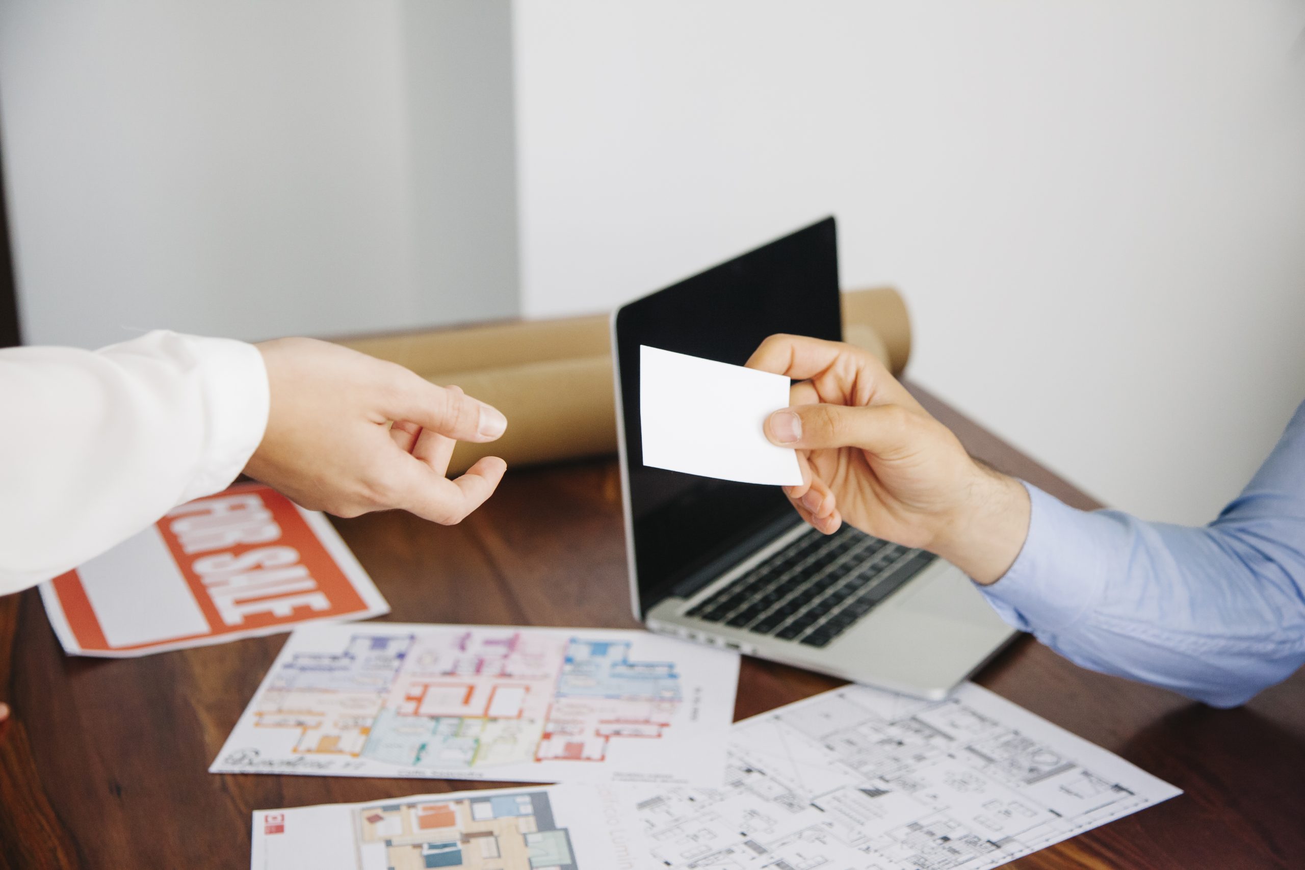 real-estate-workers-with-business-card Home Villa Purchase